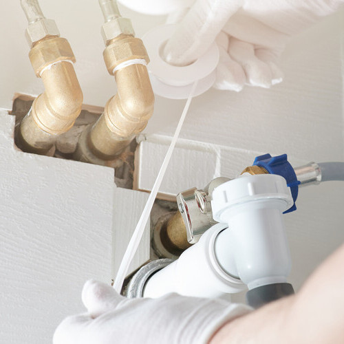 plumber fixing a shower leake