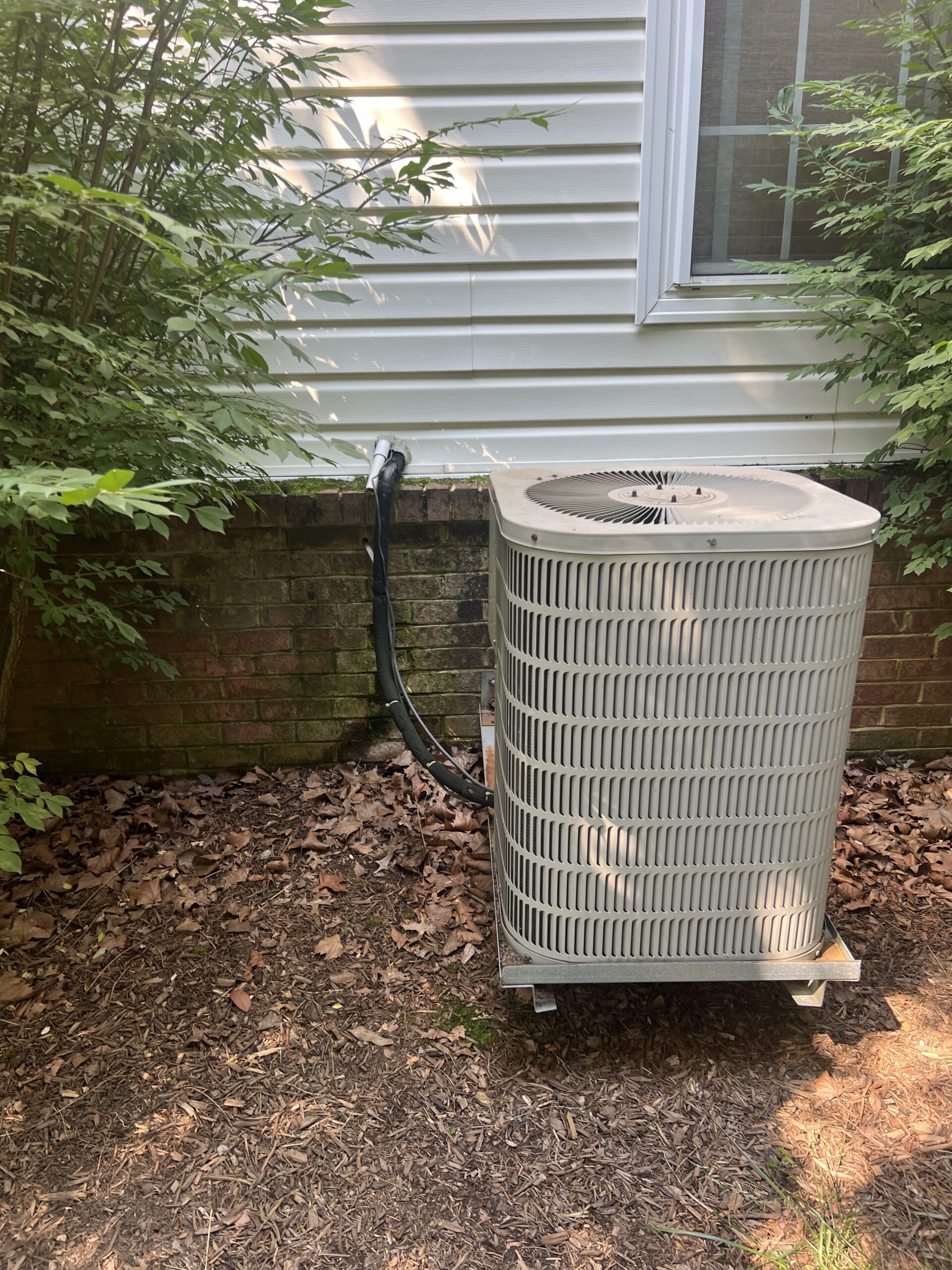 Outdoor air conditioning condenser unit checked during HVAC service in Ashburn, Virginia
