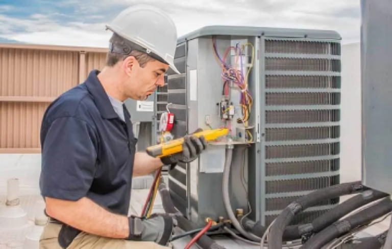 HVAC technician inspecting an outdoor heat pump beside a home in Spotsylvania during early fall